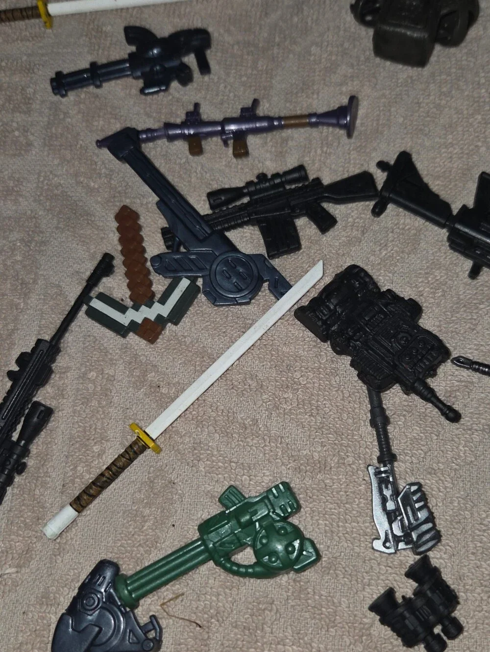 Huge lot of action figure weapons all kinds this is a dream lot for kids